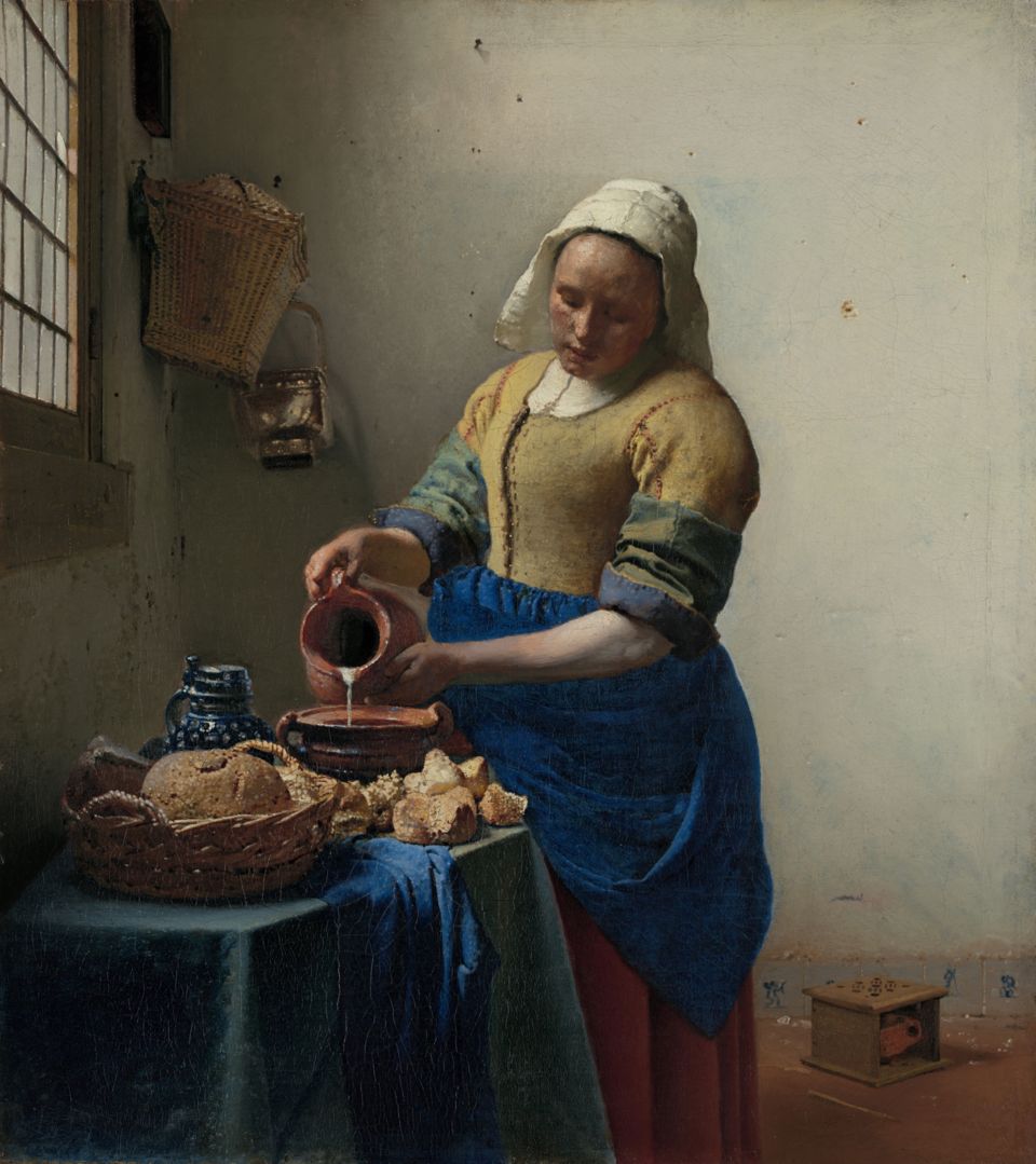 A painting of a woman in a yellow bodice and blue apron pouring milk from a jug into a bowl, beside a window
